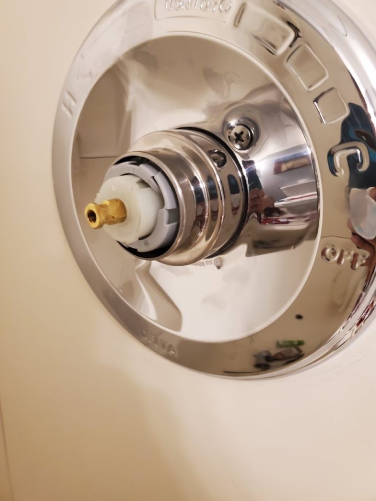 Shower valve cartridge replacement in bathroom