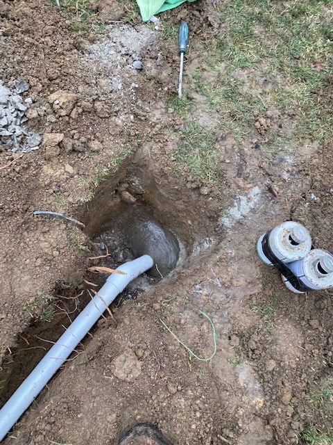 Sump pump discharge line installation