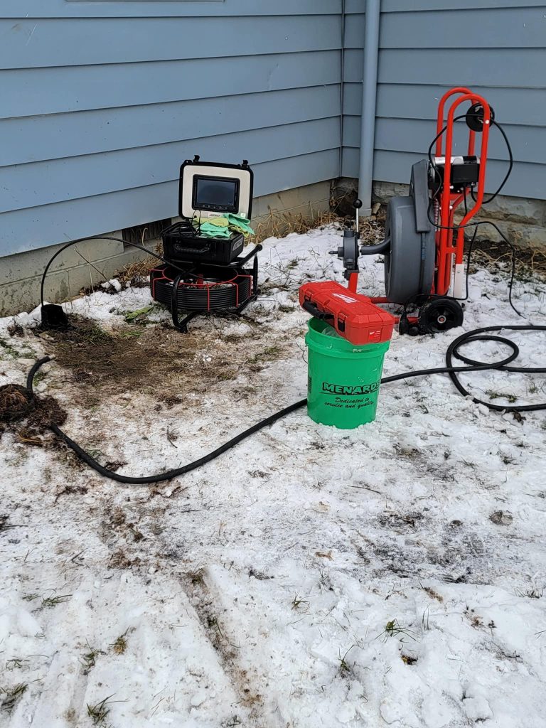 Sewer camera and auger machine after drain cleaning.