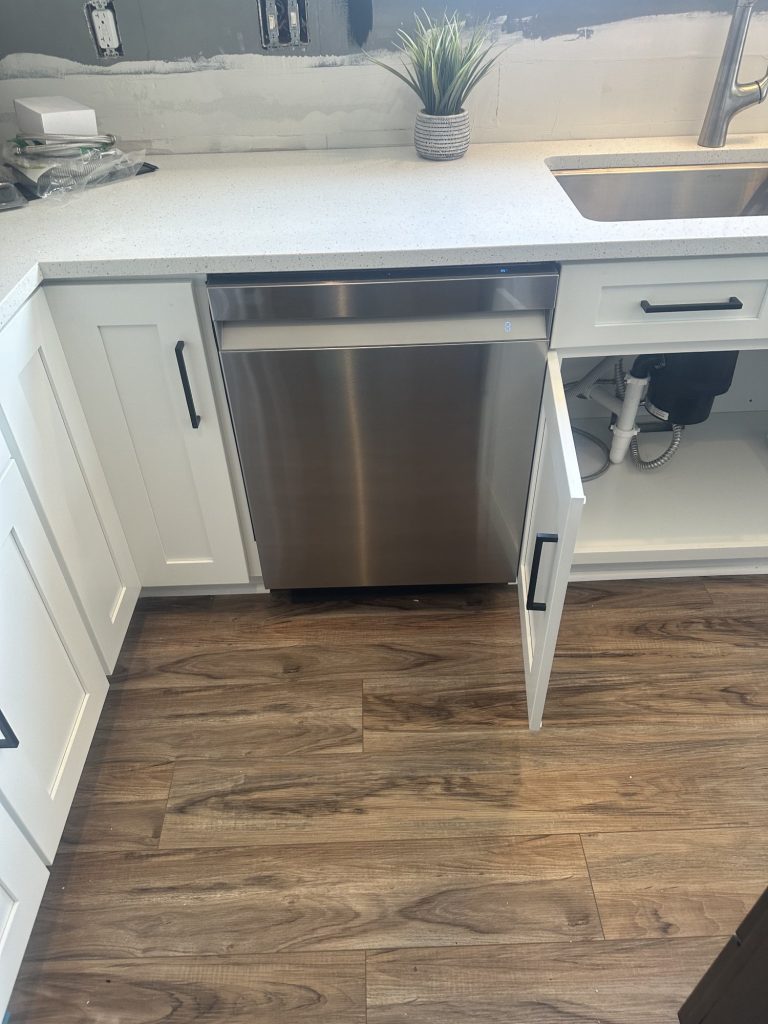 Recently installed silver dishwasher.